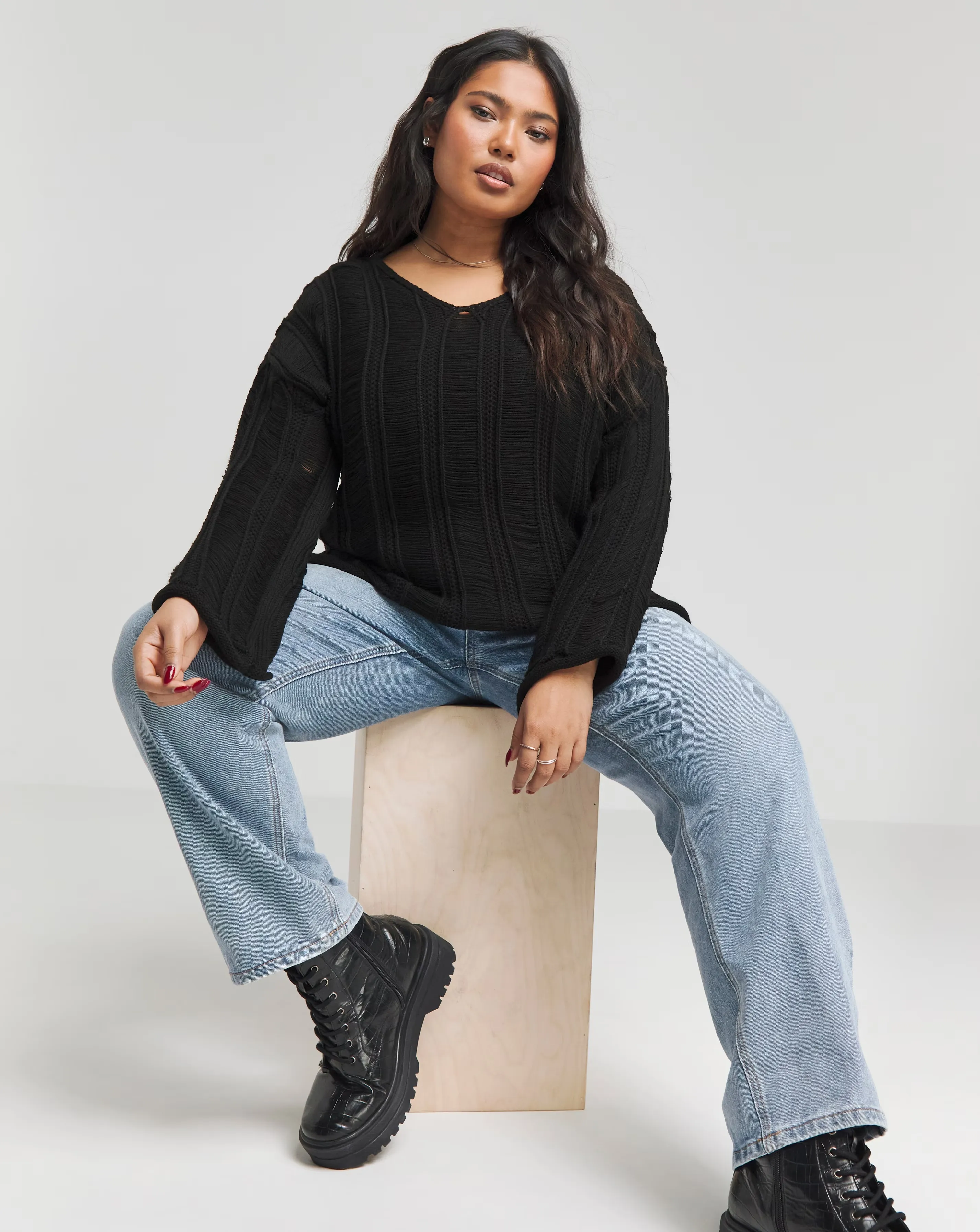 101336-black-ladder-detail-v-neck-jumper-1.webp