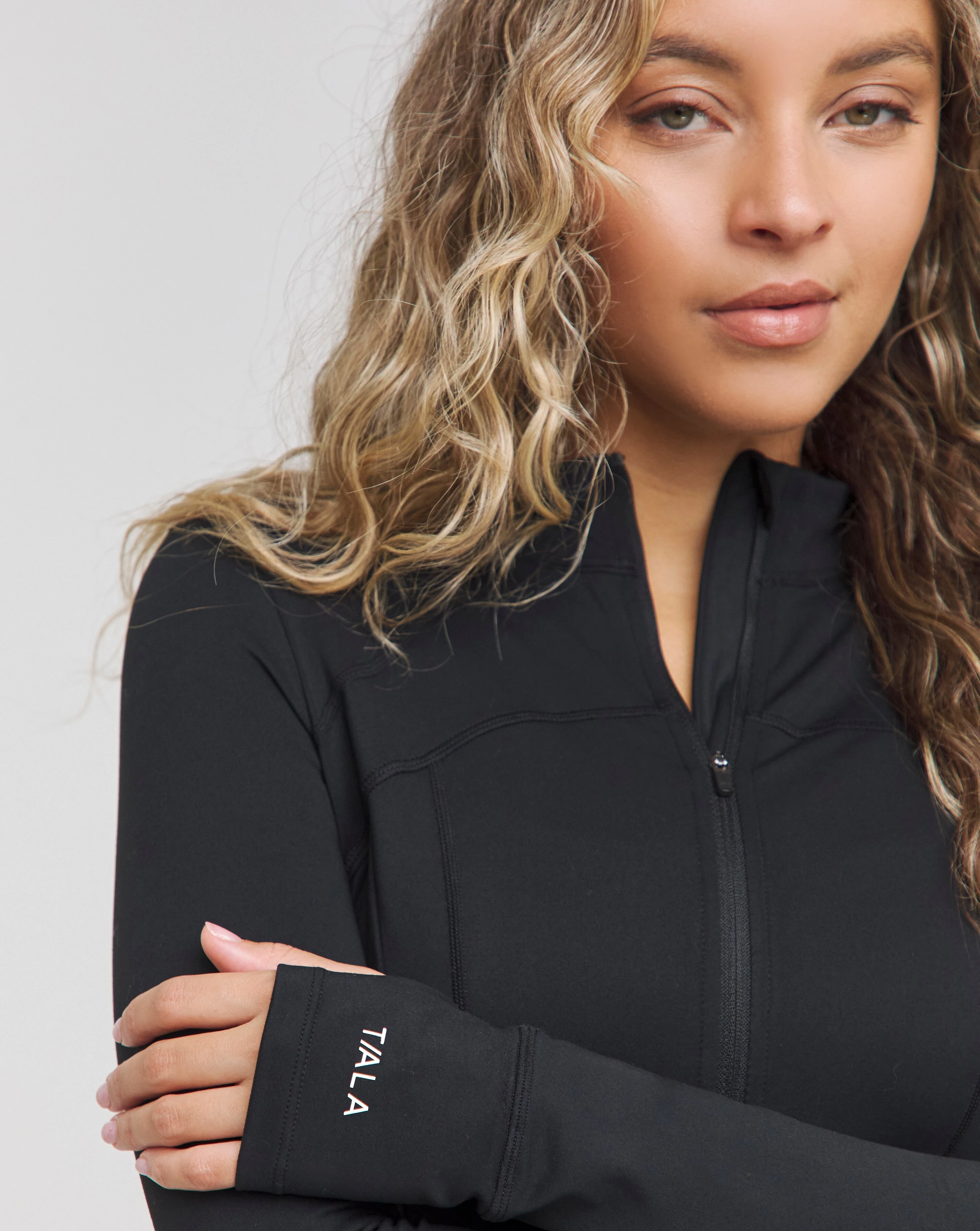 103311-tala-skinluxe-zip-through-full-length-running-top-1.webp