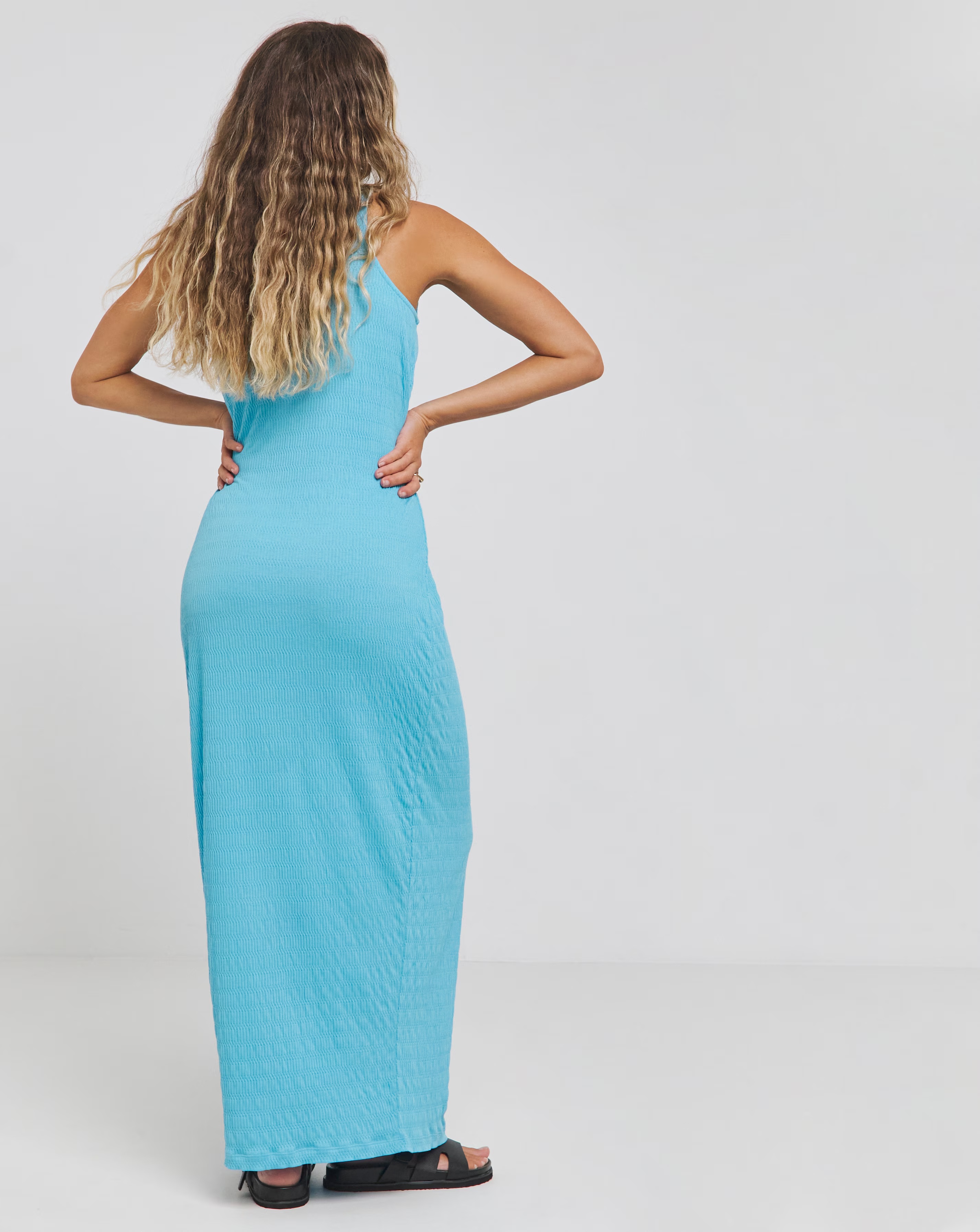 127189-blue-textured-jersey-racer-maxi-dress-1.webp