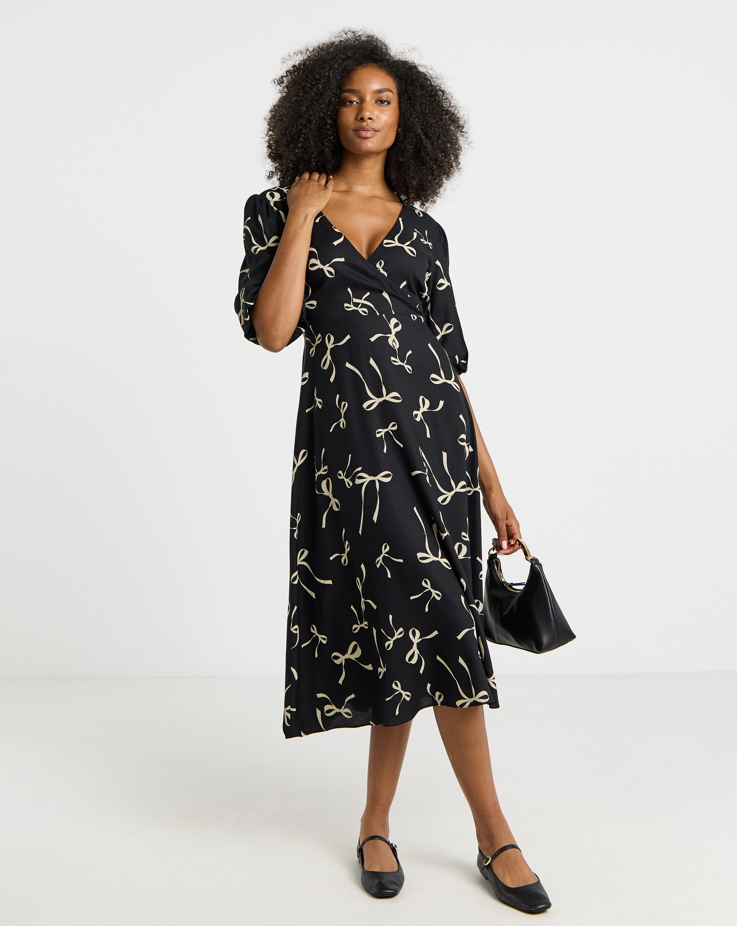 Simply Be Bow Print Viscose Wrap Midi Dress 1 131865-simply-be-bow-print-viscose-wrap-midi-dress-1.webp