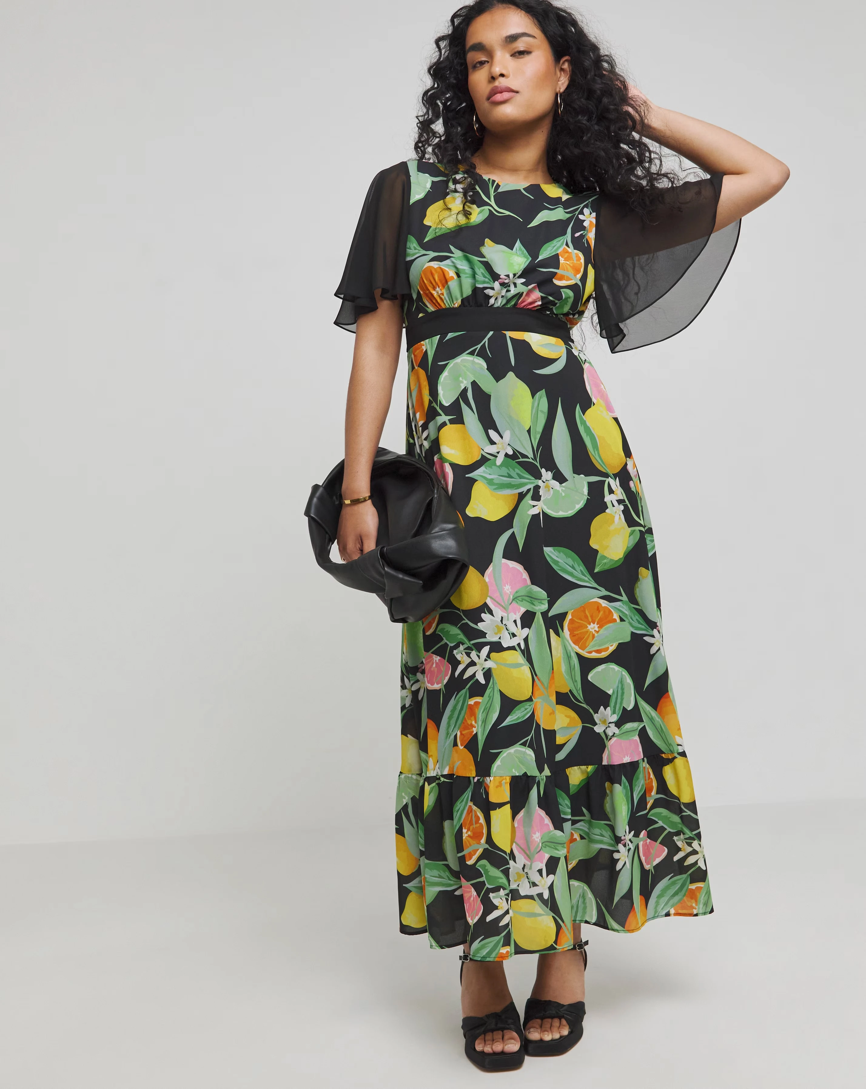 149475-twisted-wunder-black-chiffon-fruit-frill-hem-maxi-dress-1.webp