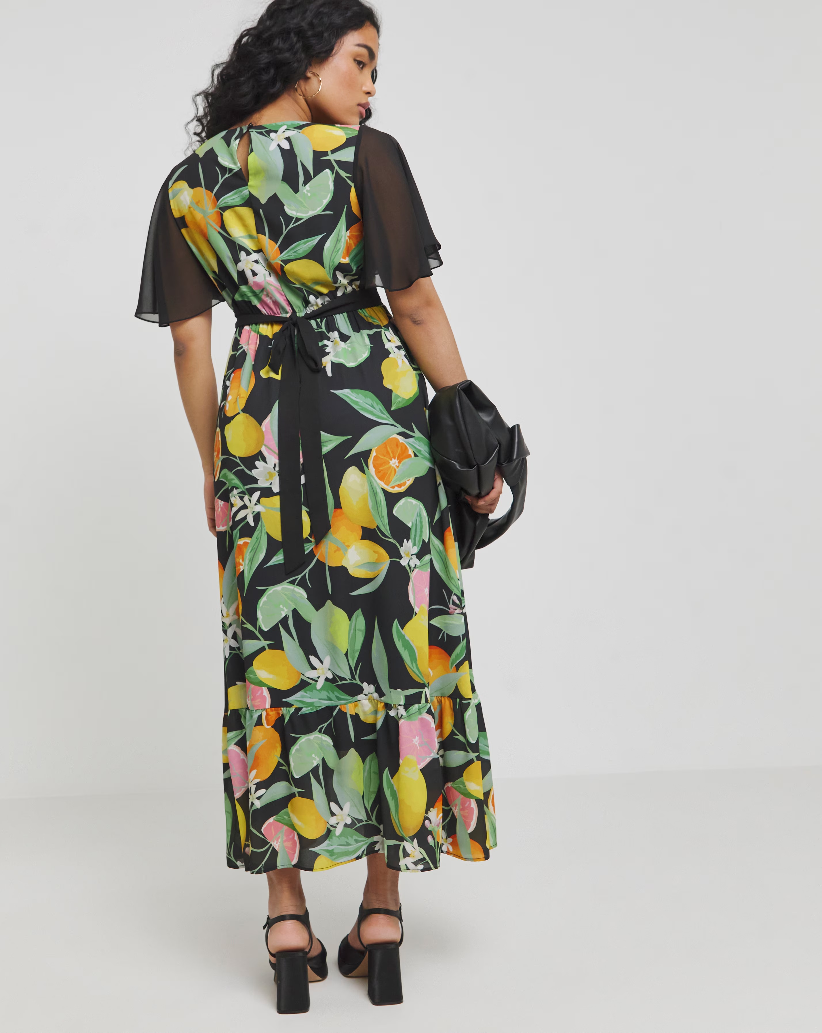 149475-twisted-wunder-black-chiffon-fruit-frill-hem-maxi-dress-1.webp
