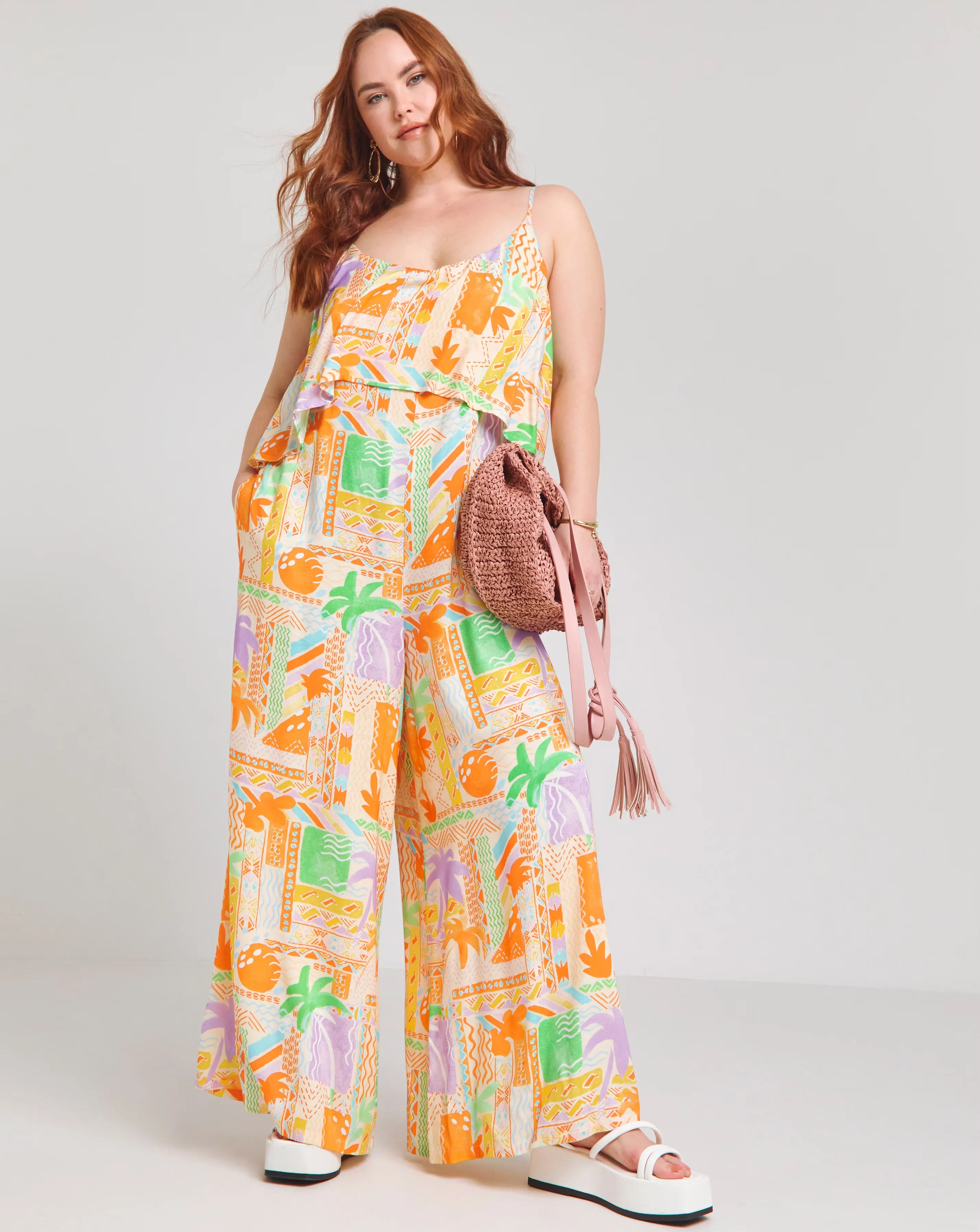 151001-native-youth-strappy-beach-palm-print-loose-fit-jumpsuit-1.webp