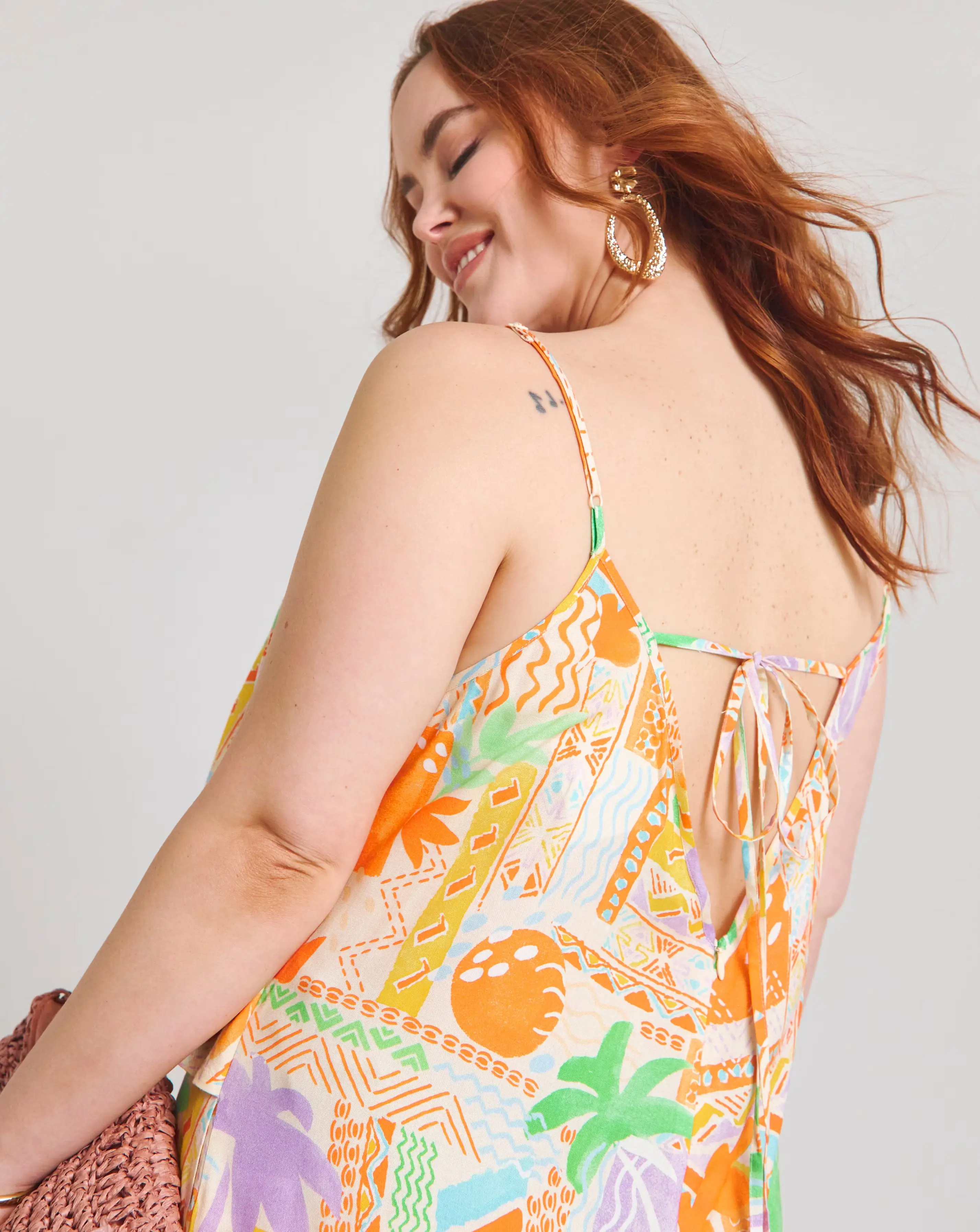 151001-native-youth-strappy-beach-palm-print-loose-fit-jumpsuit-1.webp