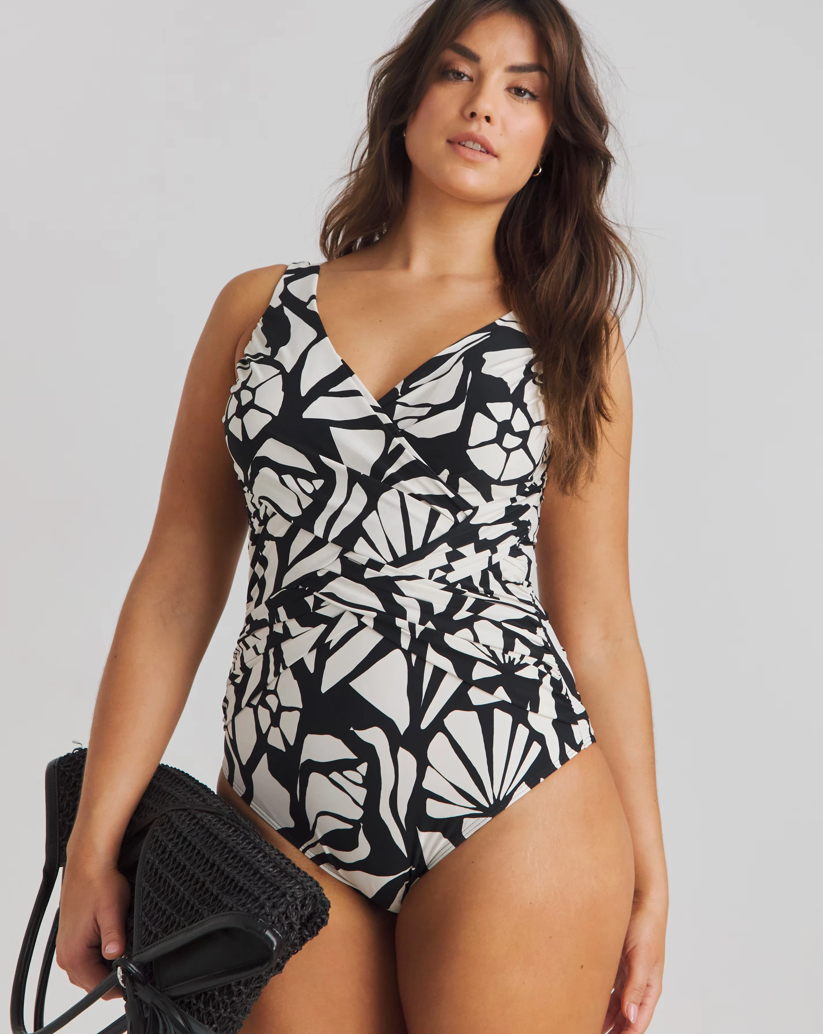 160901-magisculpt-firm-control-illusion-swimsuit-longer-length-1.webp
