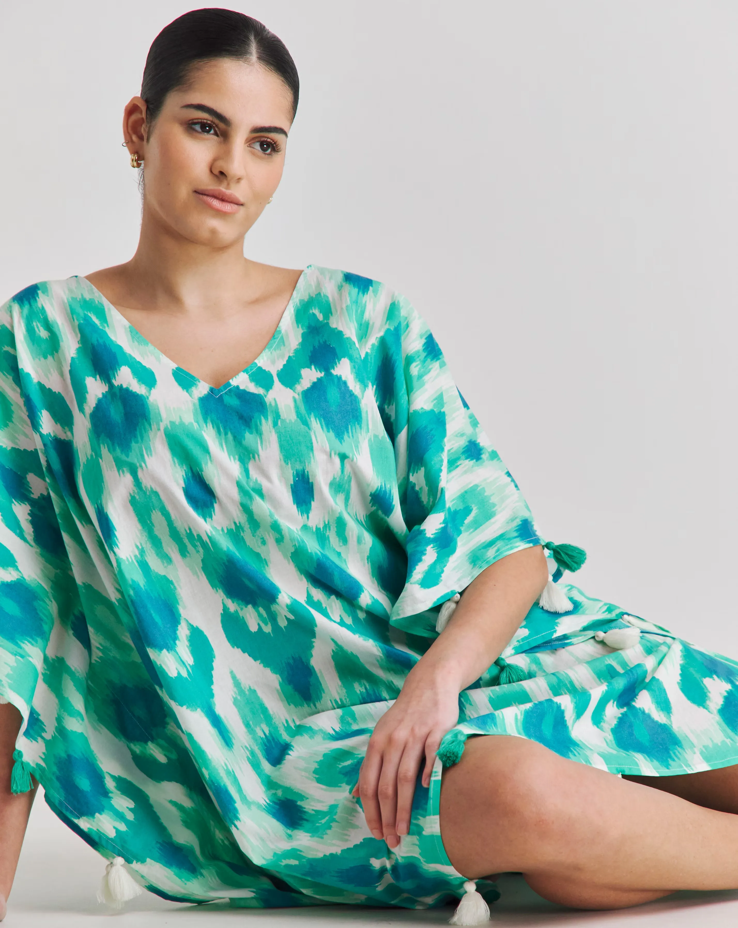 161387-magisculpt-tassel-trim-beach-kaftan-1.webp