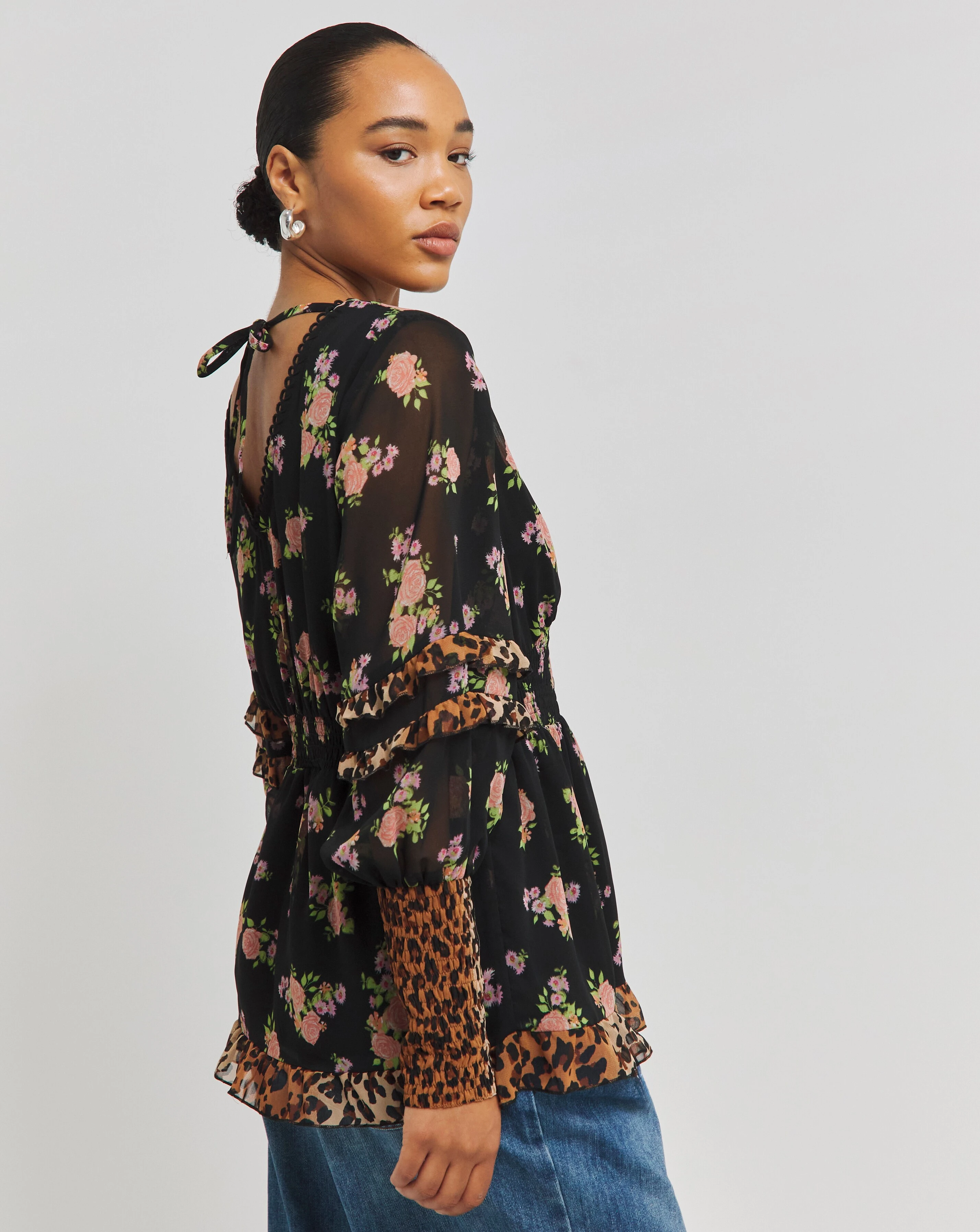 1695-mixed-print-shirred-long-sleeve-v-neck-peplum-blouse-1.webp
