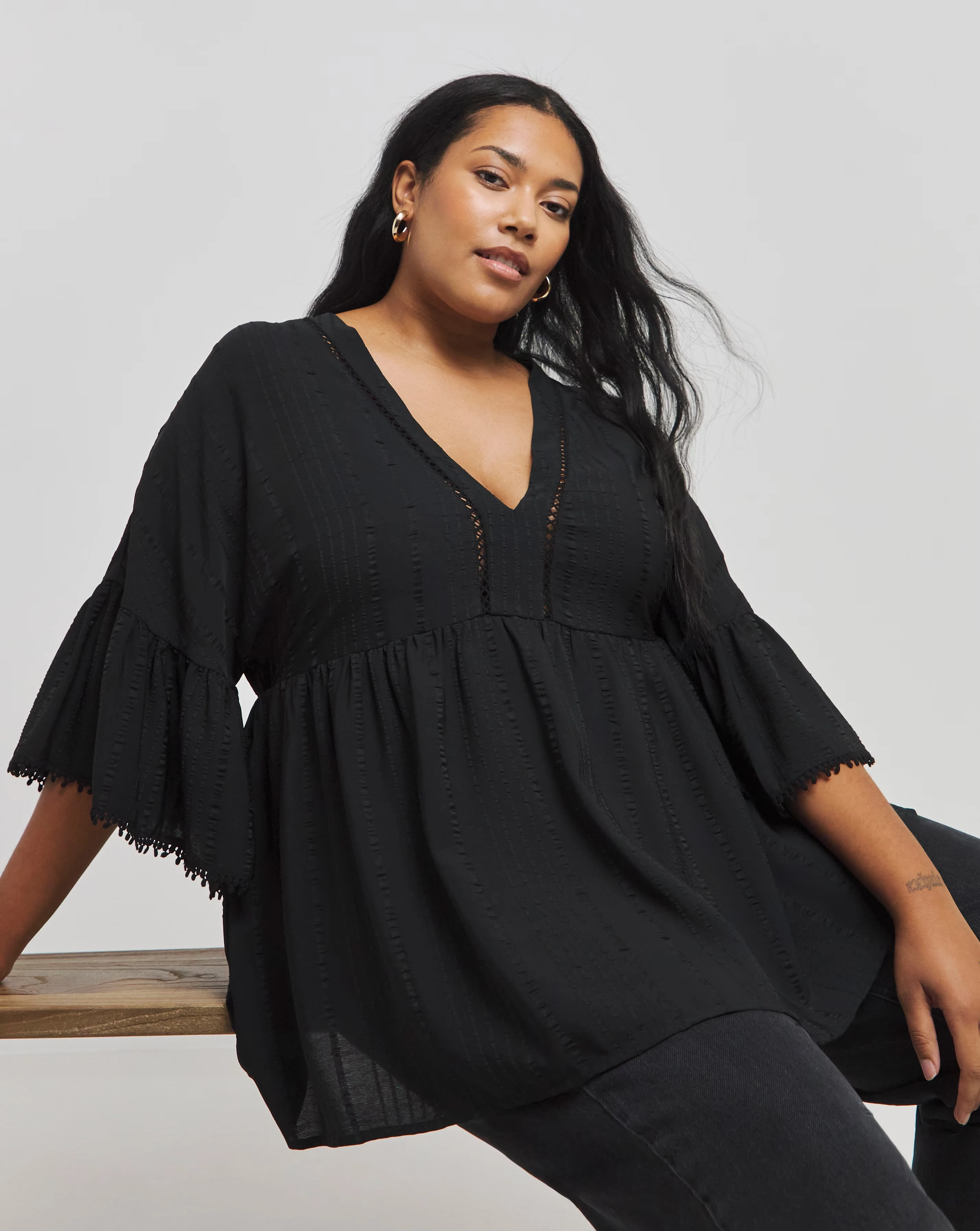 169994-black-v-neck-textured-smock-top-1.webp