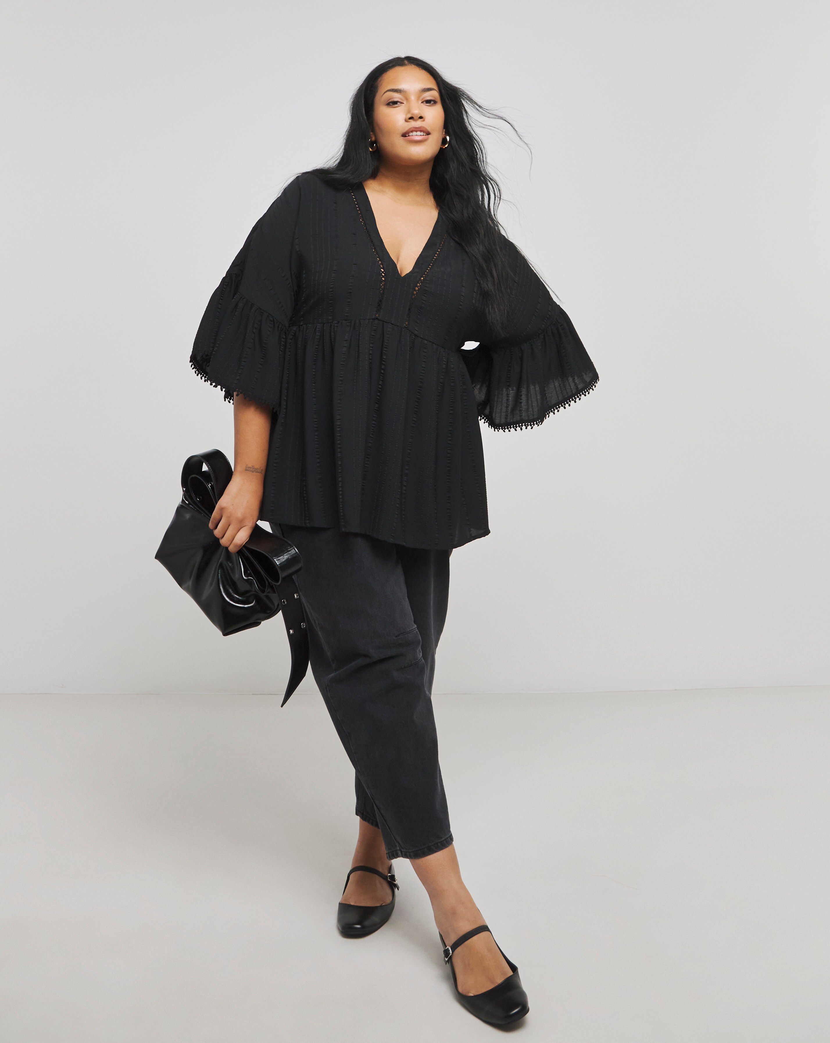 169994-black-v-neck-textured-smock-top-1.webp