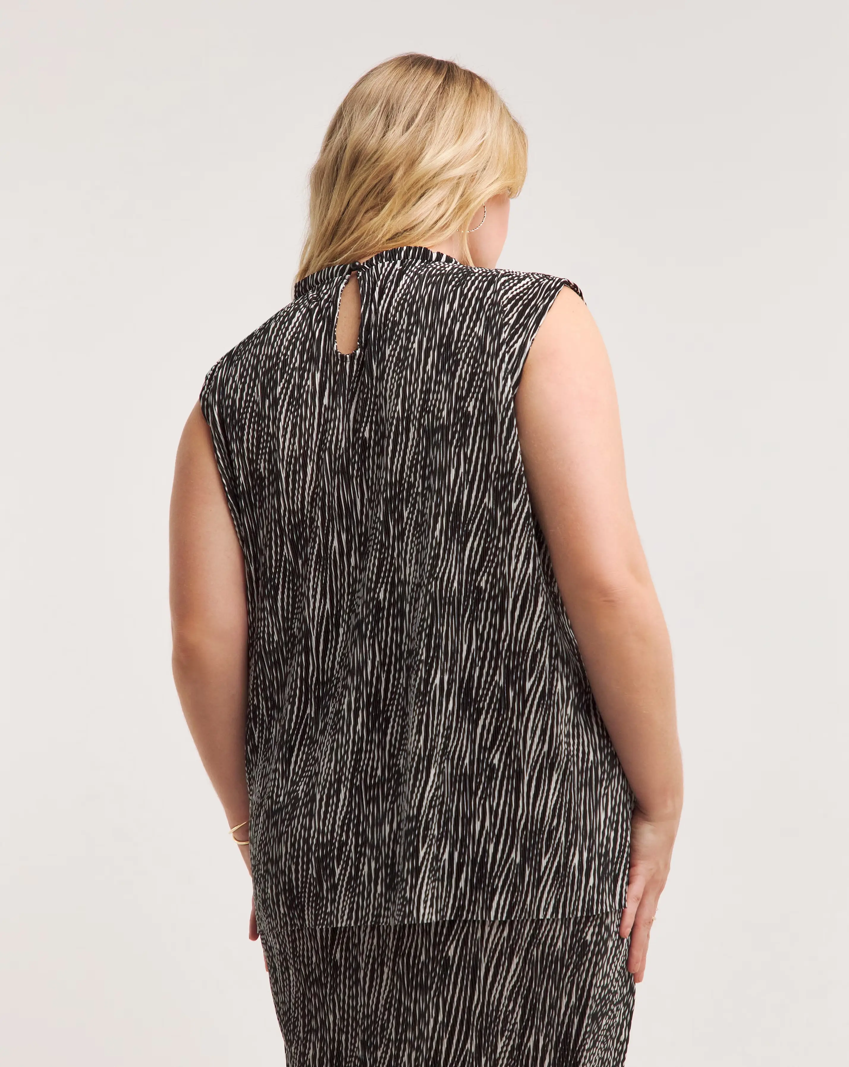 34642-zebra-print-plisse-high-neck-swing-top-1.webp