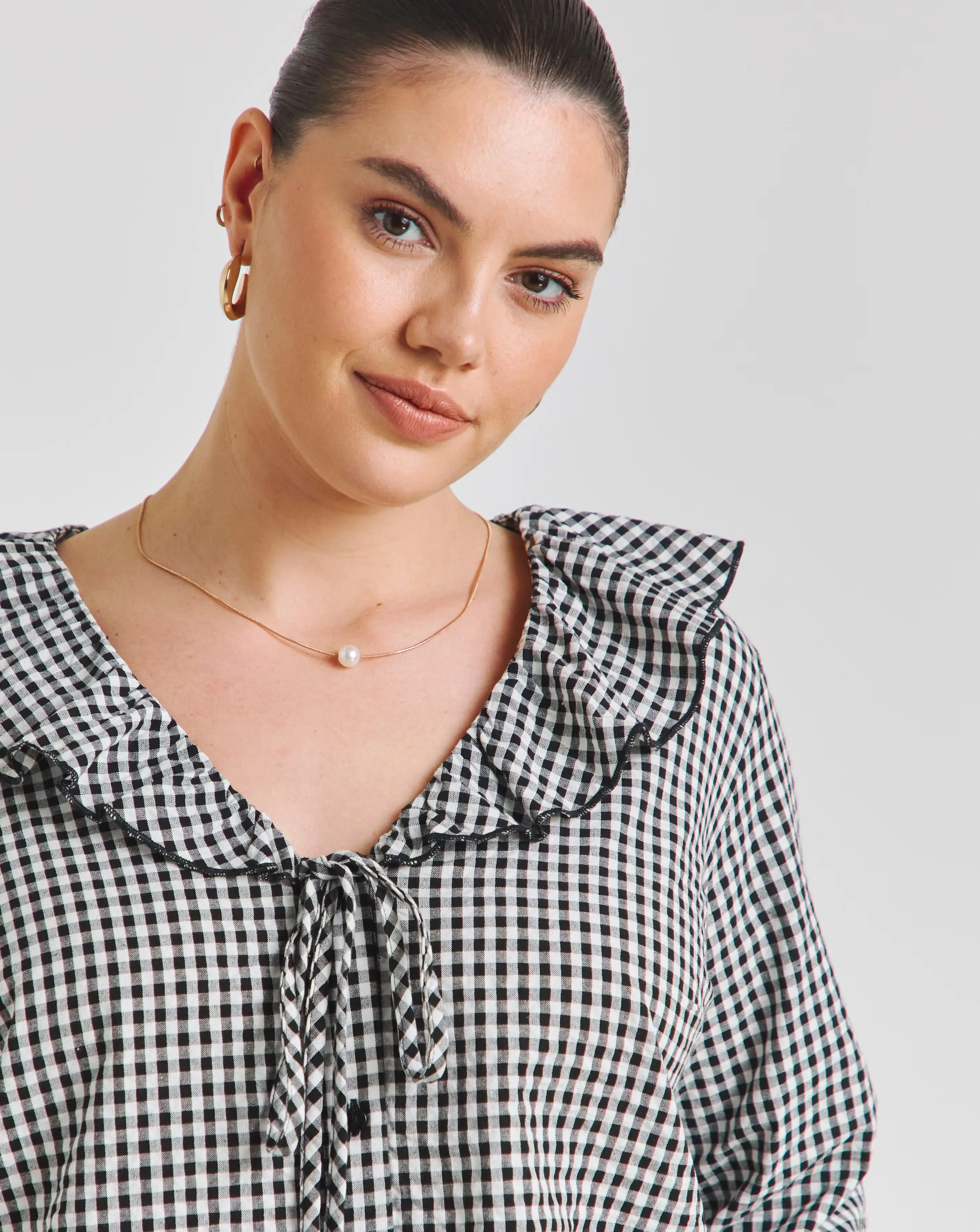 36672-gingham-ruffle-button-through-blouse-1.webp