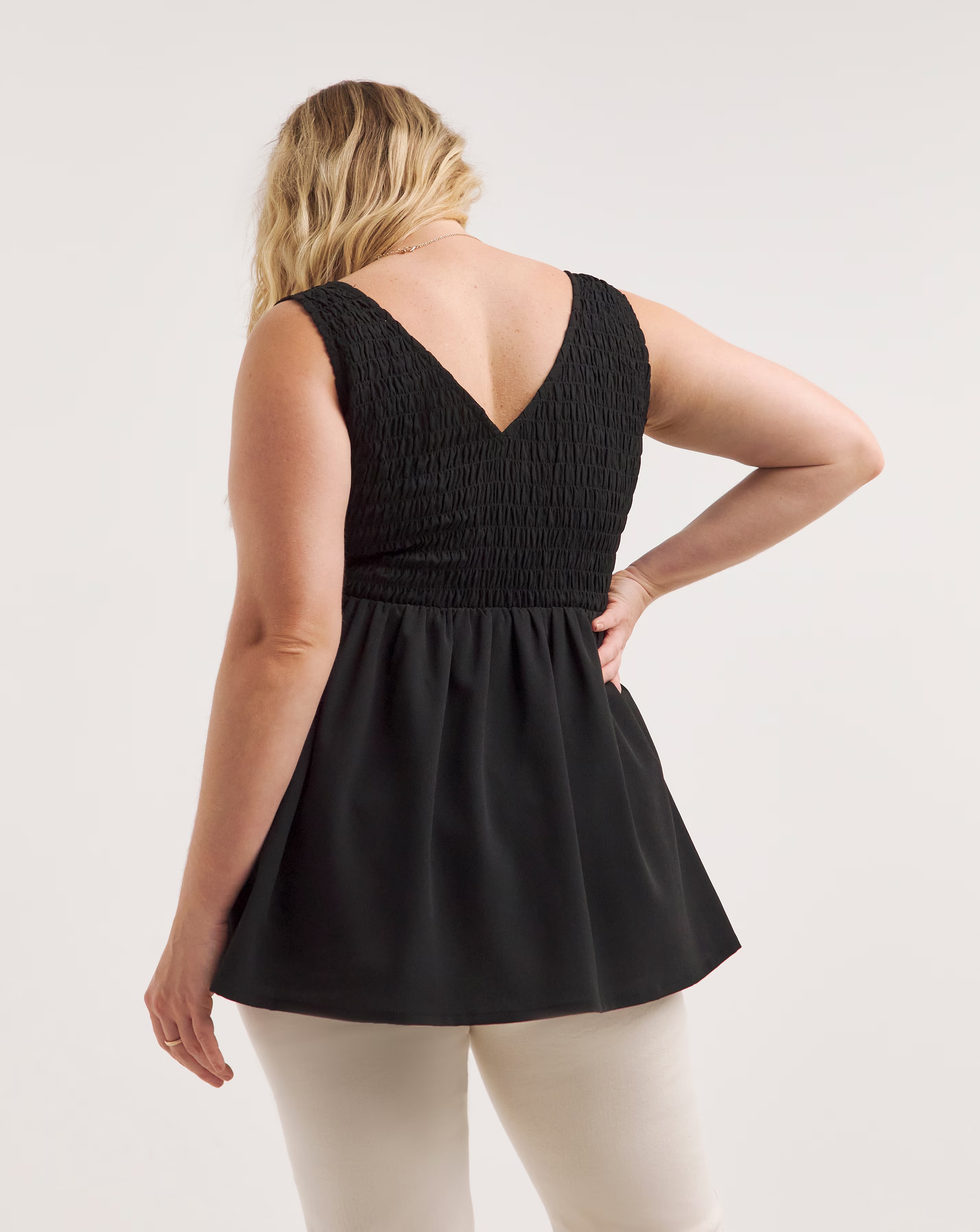 43421-black-shirred-peplum-vest-1.jpg