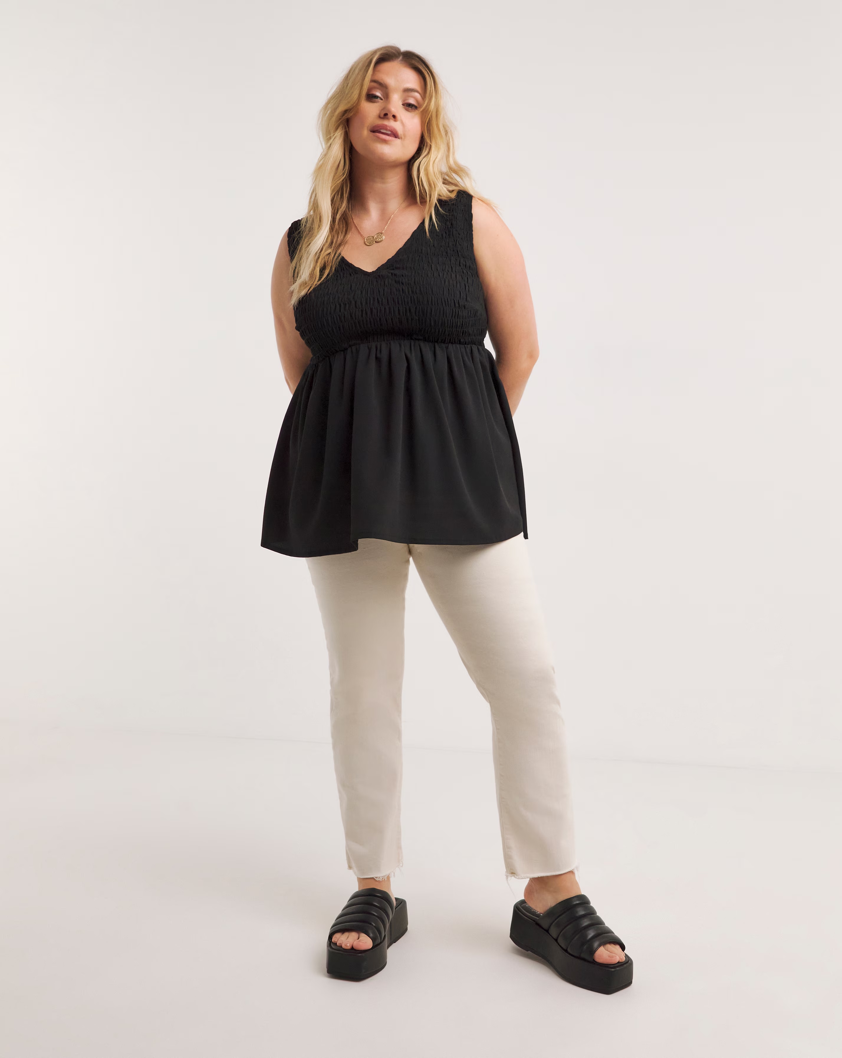 43421-black-shirred-peplum-vest-1.jpg