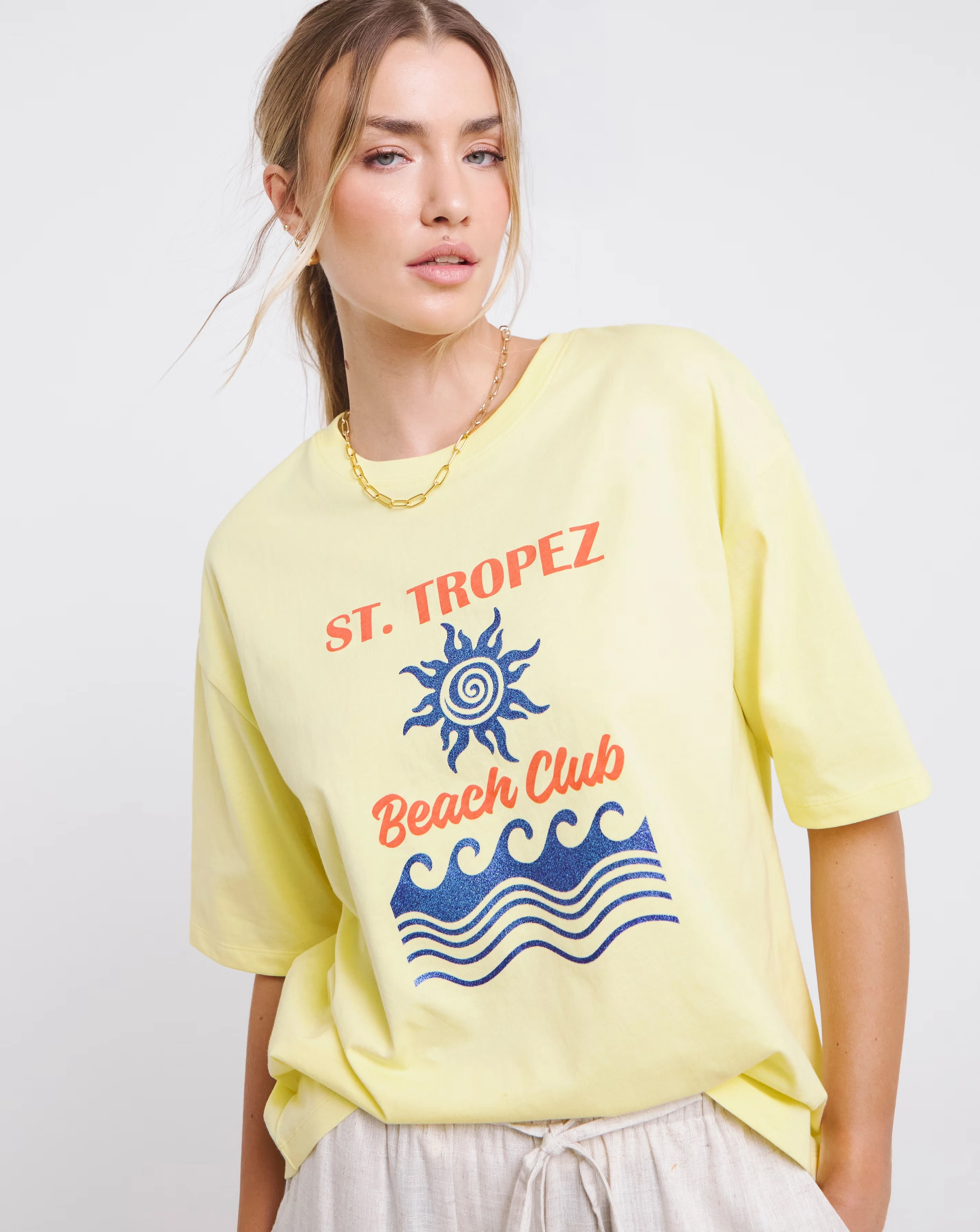 47075-simply-be-light-yellow-glitter-st-tropez-graphic-t-shirt-1.webp