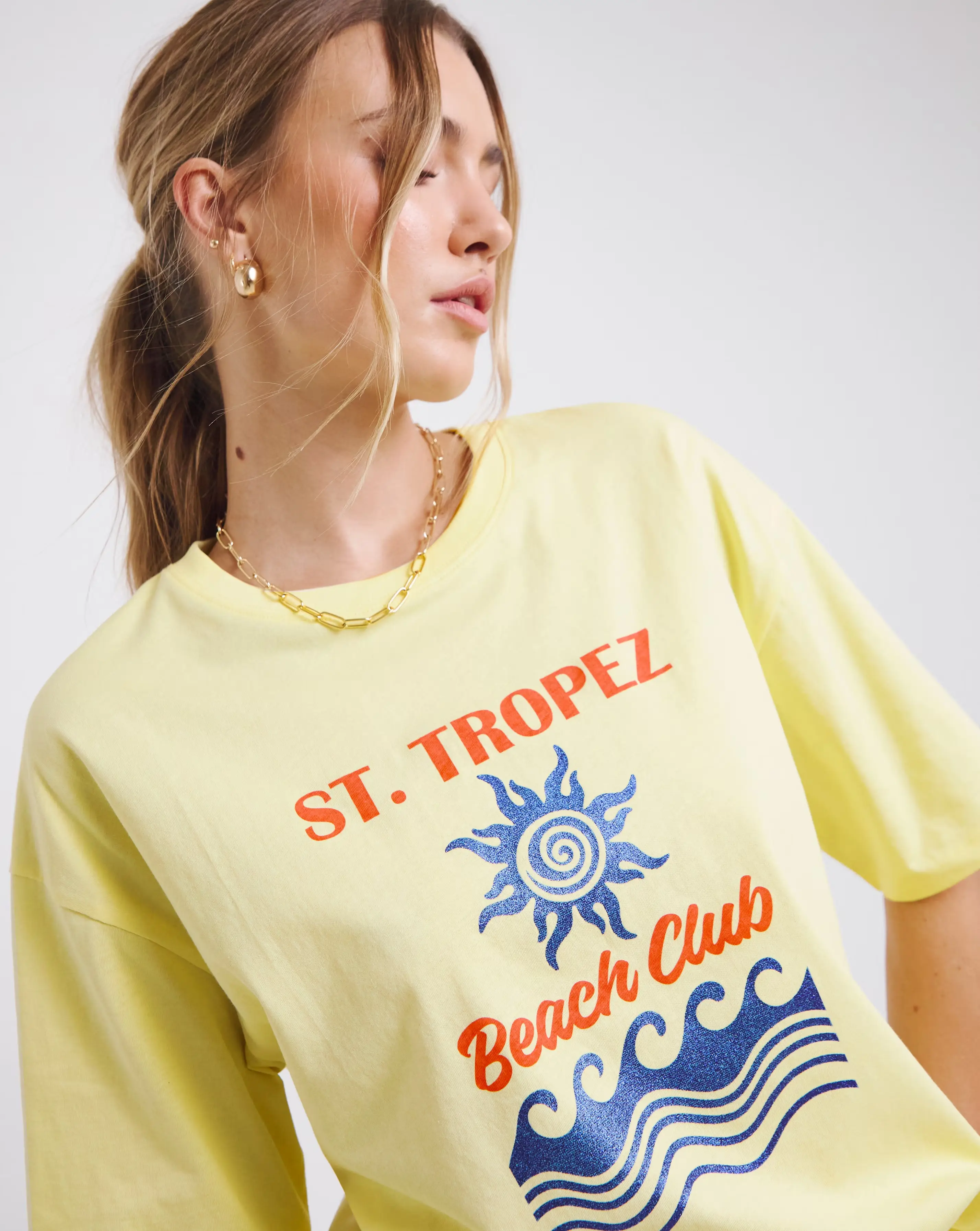 47075-simply-be-light-yellow-glitter-st-tropez-graphic-t-shirt-1.webp