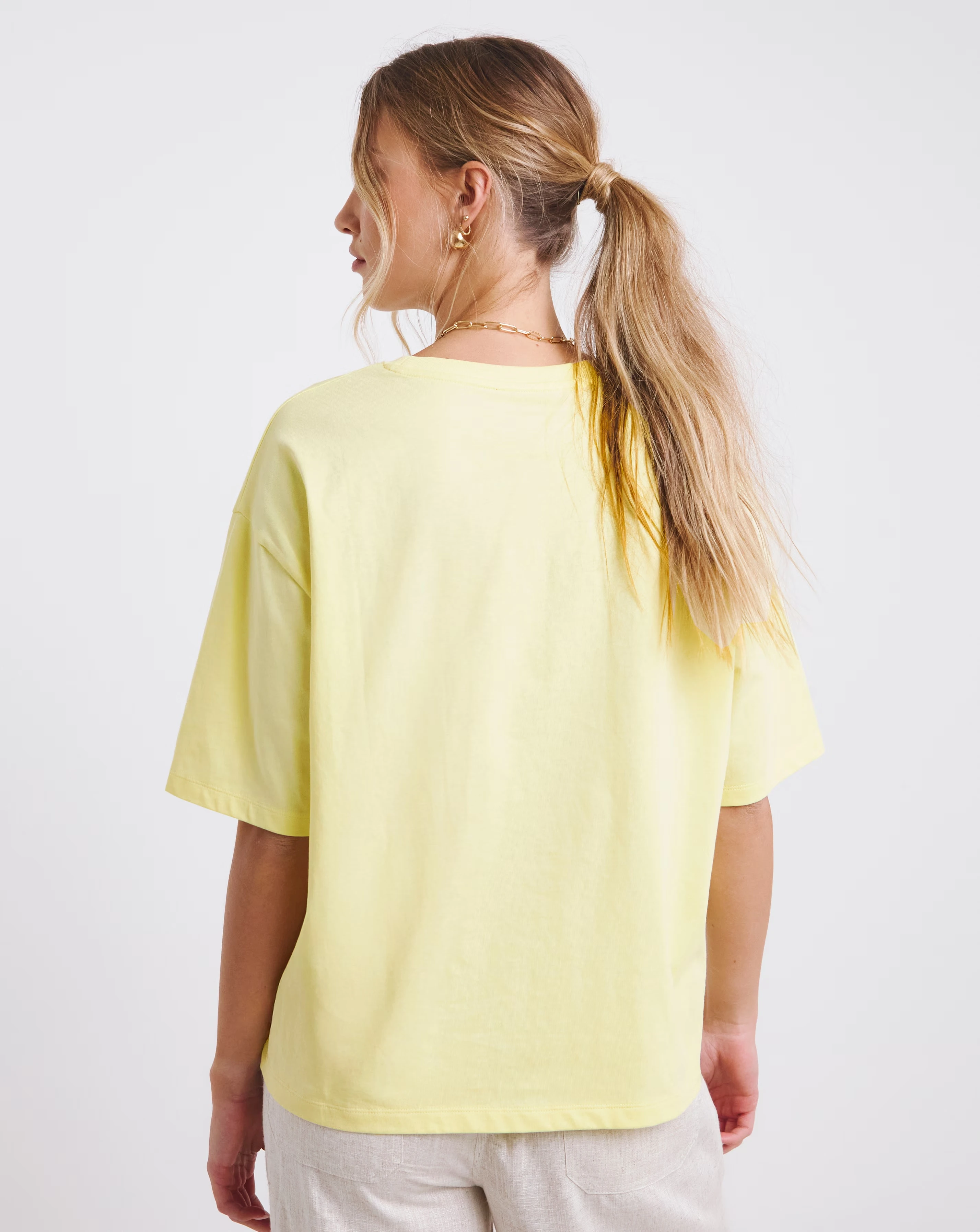 47075-simply-be-light-yellow-glitter-st-tropez-graphic-t-shirt-1.webp