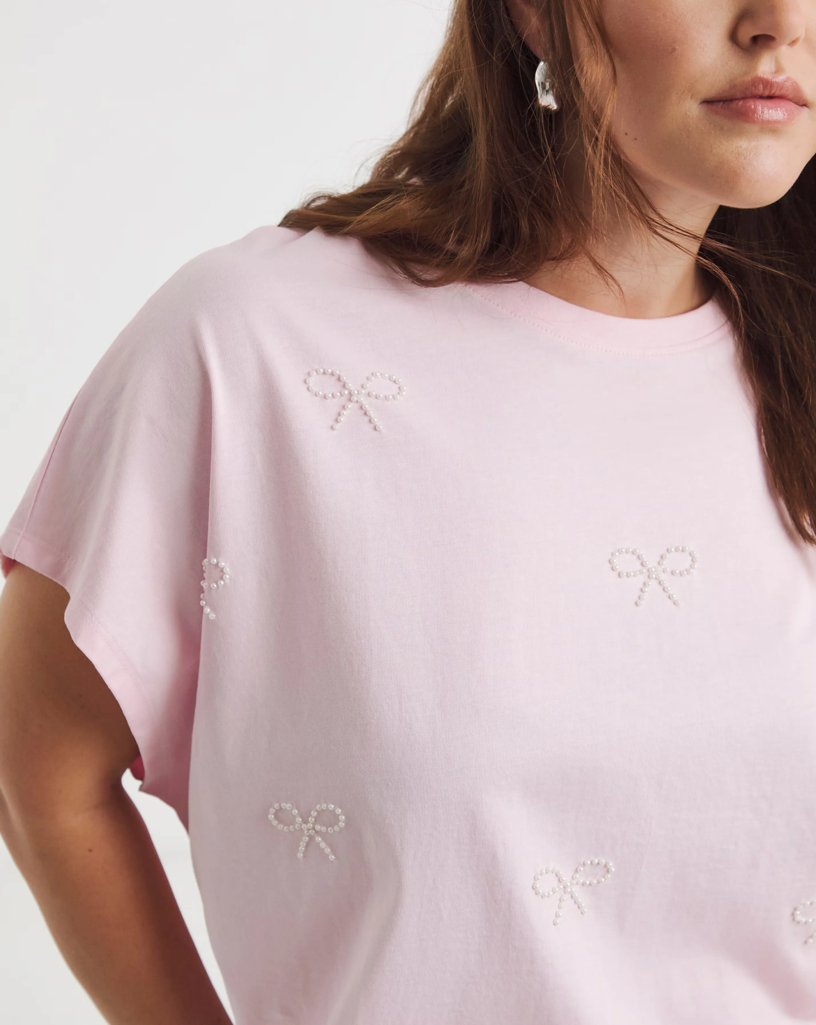 Simply Be Pink Pearl Bow Trim T-Shirt 1 47140-simply-be-pink-pearl-bow-trim-t-shirt-1.webp