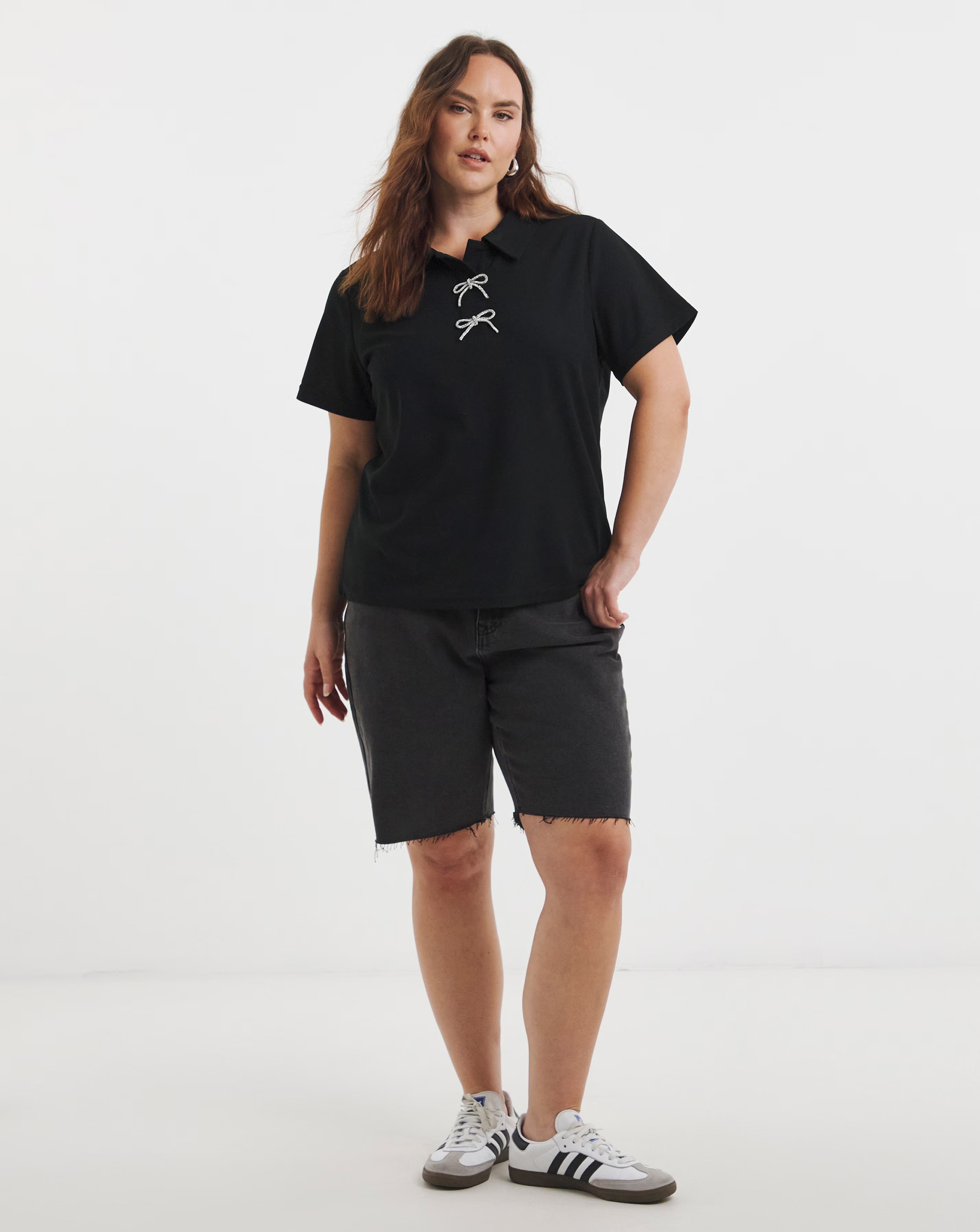 47282-simply-be-black-polo-top-with-bow-embellishment-1.webp