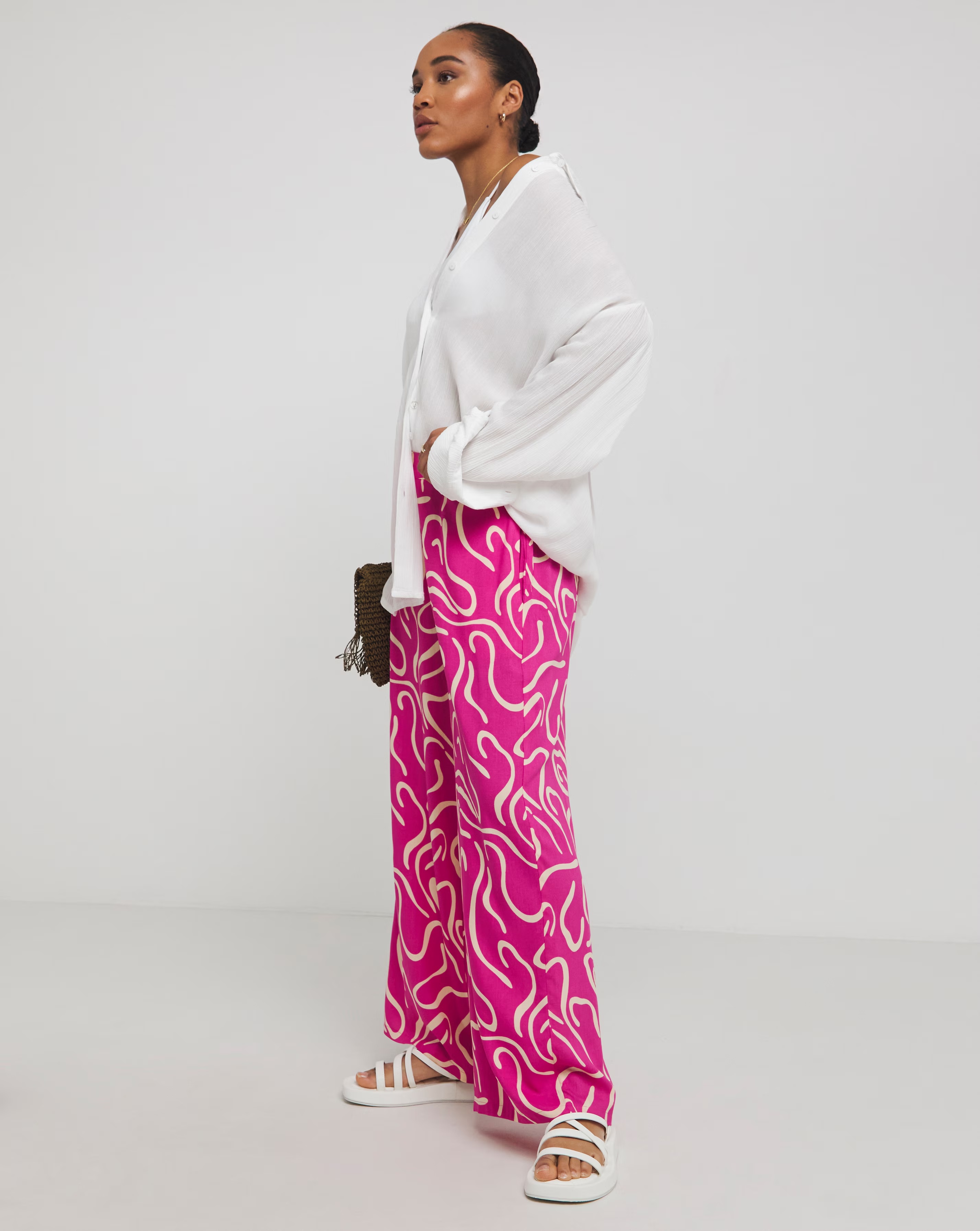 74100-simply-be-pink-print-wide-leg-trousers-1.webp