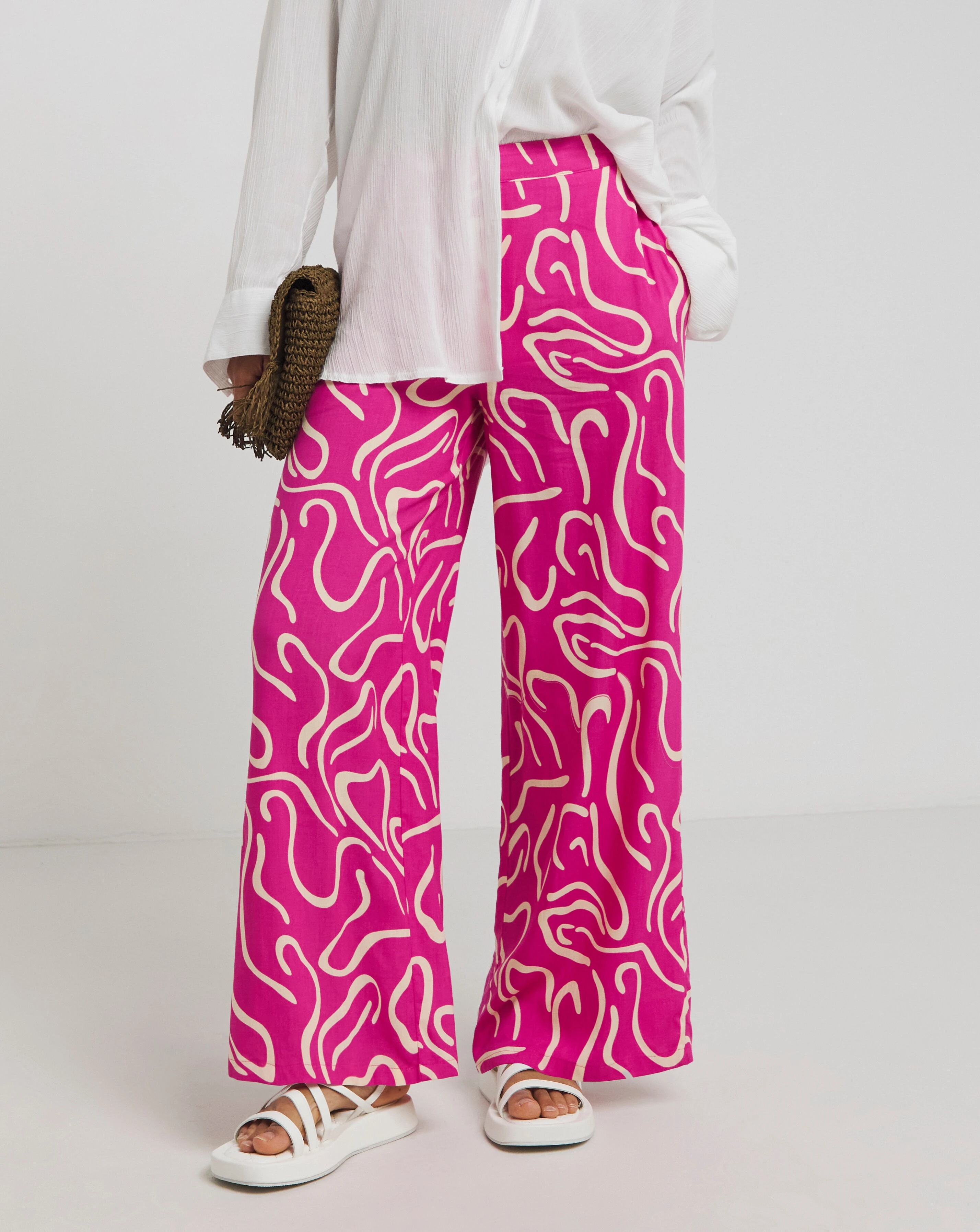 74100-simply-be-pink-print-wide-leg-trousers-1.webp