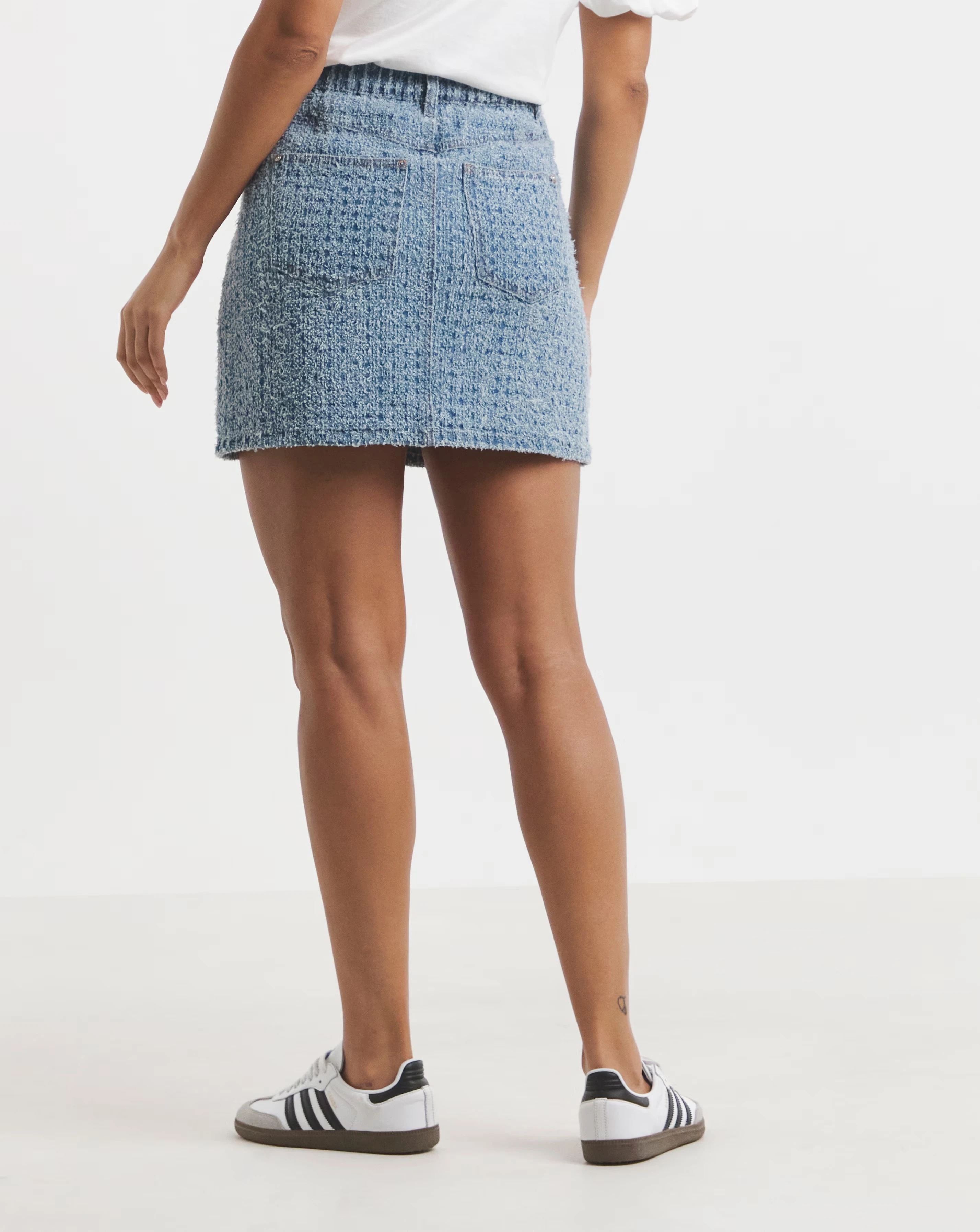 9092-light-mid-blue-distrssed-denim-mini-skirt-1.webp