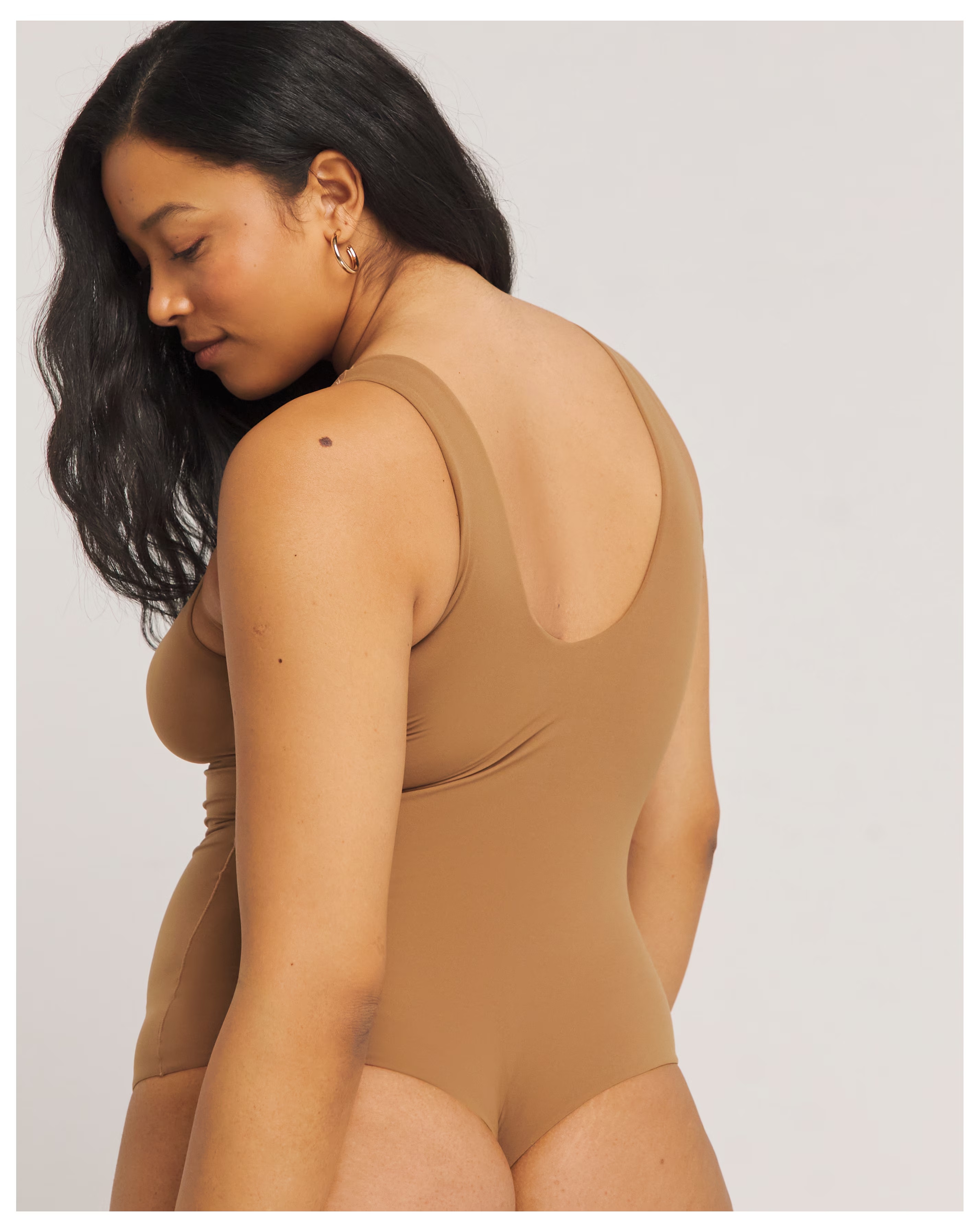 9384-magisculpt-light-control-smoothing-vest-bodysuit-1.jpg